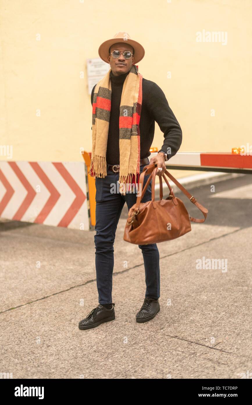 classy man with stylish casual men´s fashion outfit, at barrier at  industrial area in Munich, Germany Stock Photo - Alamy
