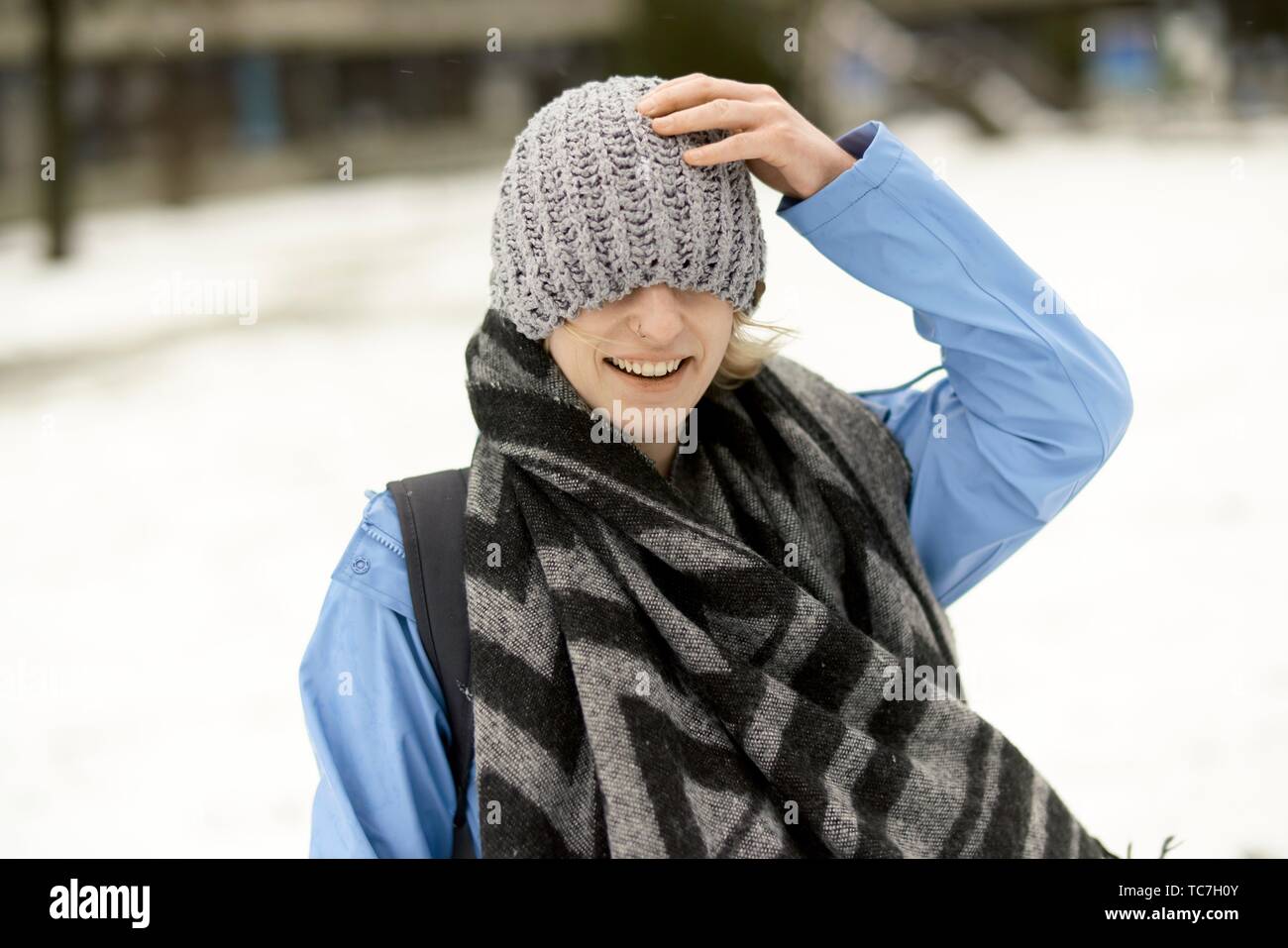 woman wrapped in winter clothes, in Munich, Germany Stock Photo