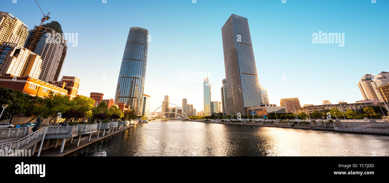 low angle view of modern skyscrapers and skyline in city at rive Stock ...