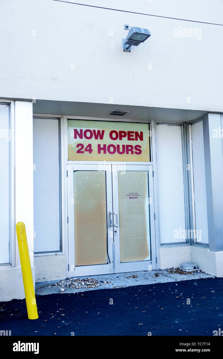 Miami Beach Florida,North Beach,business now open 24 hours,closed door,unoccupied,FL190331113 Stock Photo