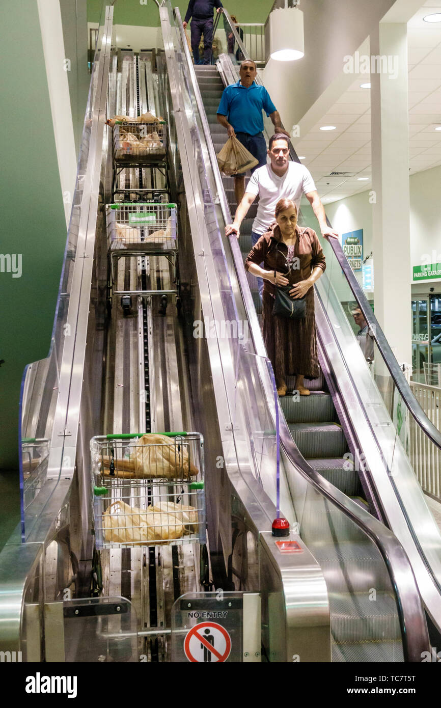 Escalator shopping carts trolleys conveyor hires stock photography and