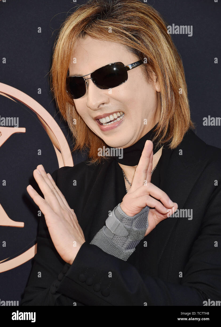 HOLLYWOOD, CA - JUNE 04: Yoshiki arrives at the Premiere Of 20th Century Fox's 'Dark Phoenix' at TCL Chinese Theatre on June 04, 2019 in Hollywood, California. Stock Photo