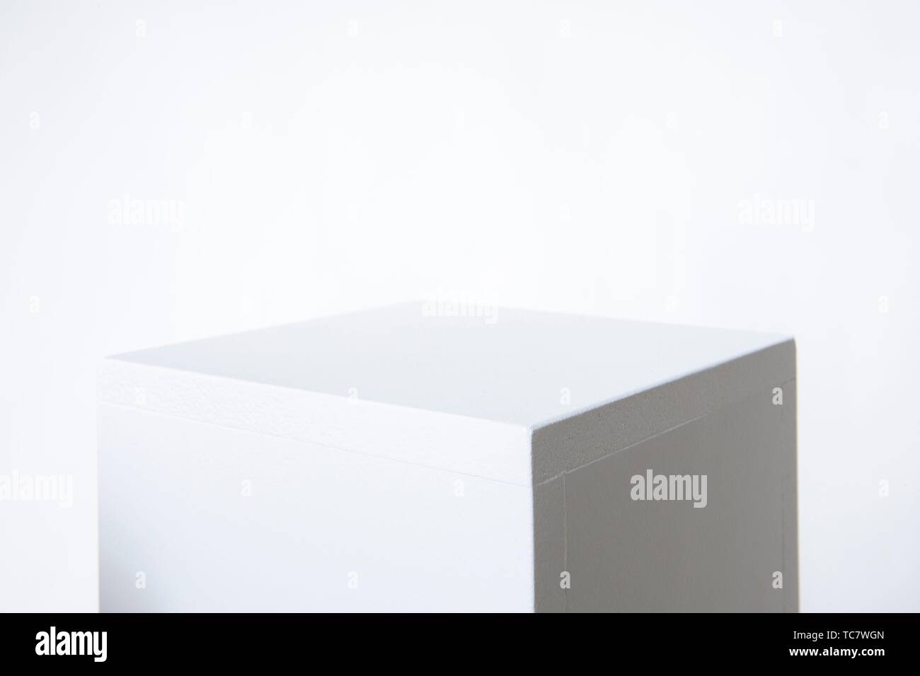 White pedestal with white background Stock Photo - Alamy