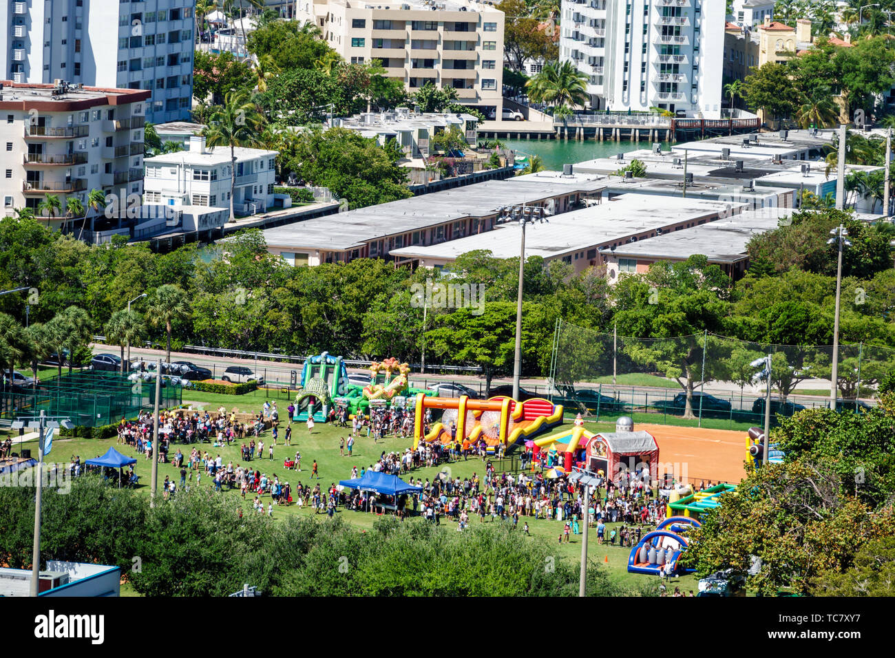Miami Beach Florida,North Beach,North Shore Park,Spring Eggstravaganza,community fair,inflatable slides slide bounce house houses,FL190430069 Stock Photo