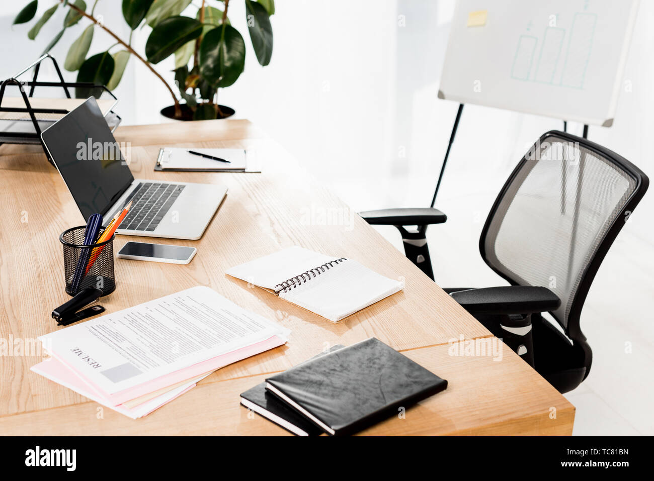 modern office with laptop smartphone - Modern Office With Laptop Smartphone Resume And Blank Notebook On Desk TC81BN 