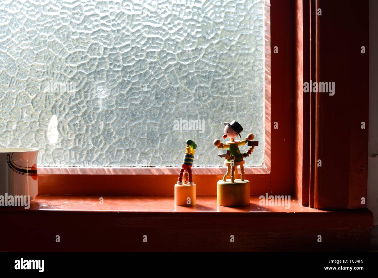 Little Sculptures On A Window Sill In An Apartment Interior