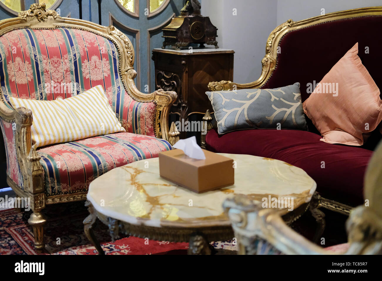 Image showcasing luxury velvet sofa with carpet in living room. home interior design ...