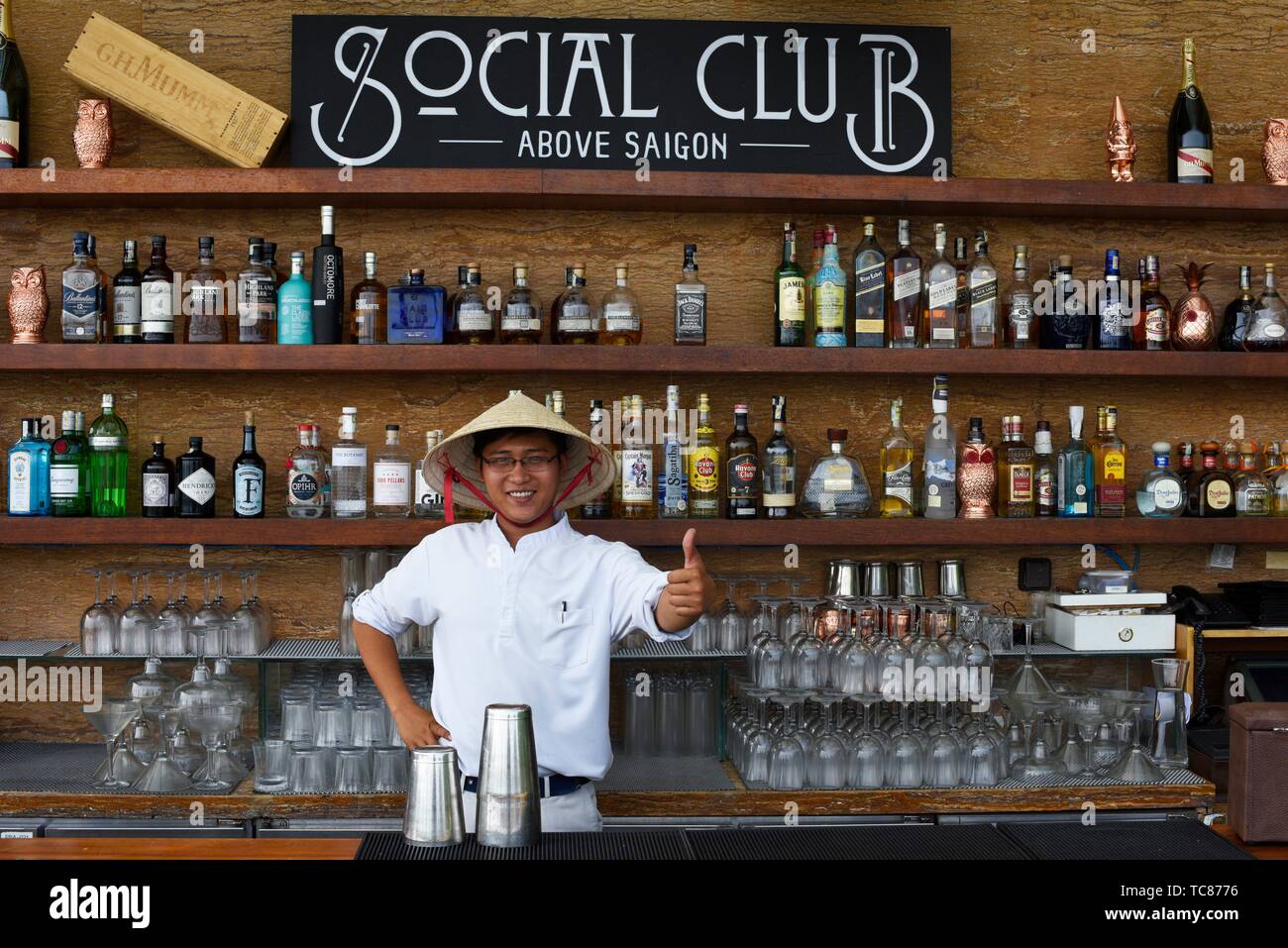 A barman at the bar of Hotel des Arts Mgallery, Ho Chi Minh City,Vietnam,South East Asia. Stock Photo