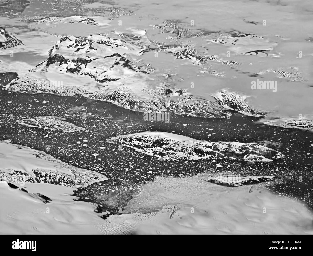 A lake in Greenland from 40,000 feet. Black and White Stock Photo - Alamy