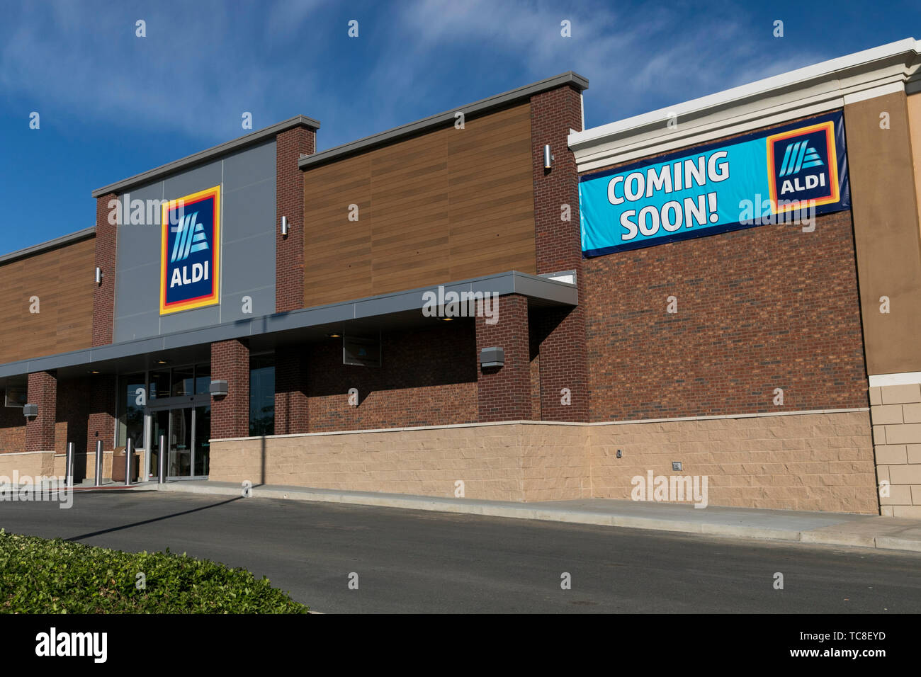 A logo sign outside of a Aldi retail grocery store location with a 'Coming Soon' banner in Martinsburg, West Virginia on June 4, 2019. Stock Photo