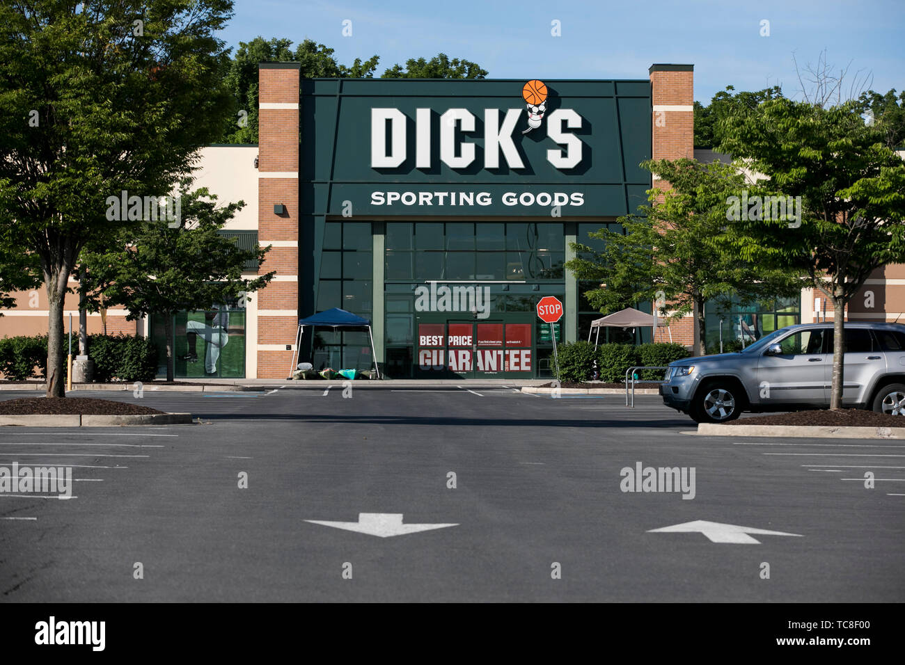 A logo sign outside of a Dick's Sporting Goods retail store location in