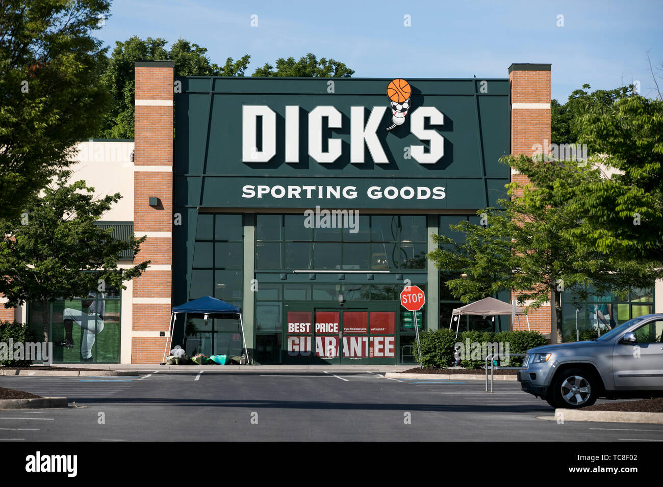 A logo sign outside of a Dick's Sporting Goods retail store location in