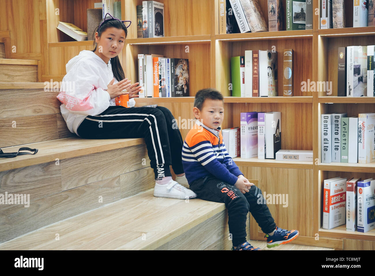 Filmed in the Xinhua Bookstore in Sihong County, Jiangsu Province on April 21, 2019, the spirit of serious learning made me press the shutter. They were too focused and did not find that I was filming them at all! Stock Photo