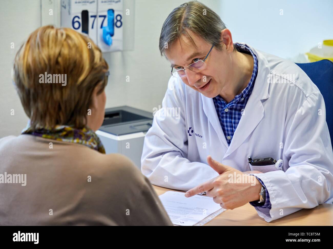 Doctor with patient in medical consultation, Oncology, Hospital Donostia, San Sebastian, Gipuzkoa, Basque Country, Spain Stock Photo