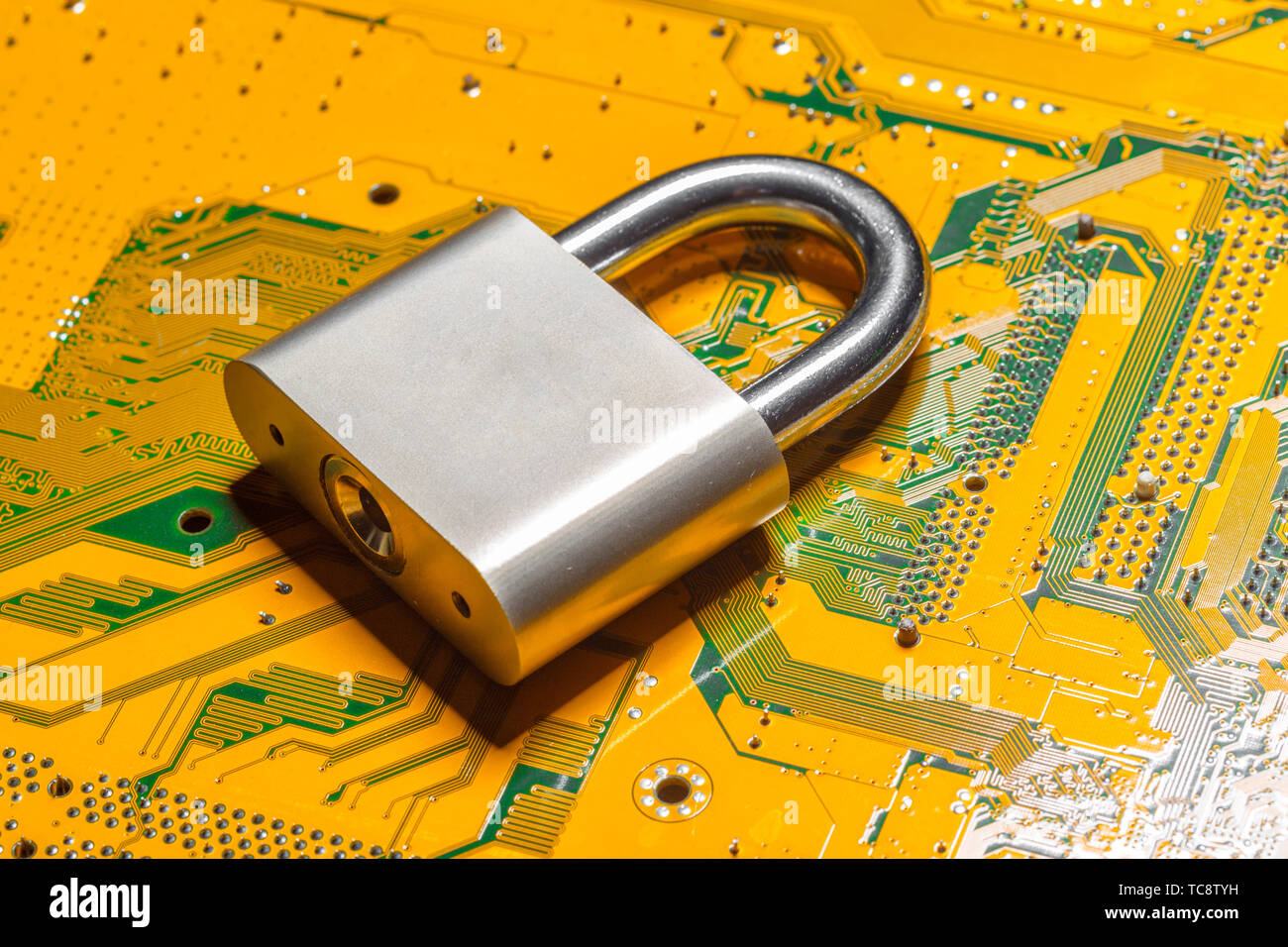 padlock on a computer circuit board Stock Photo - Alamy