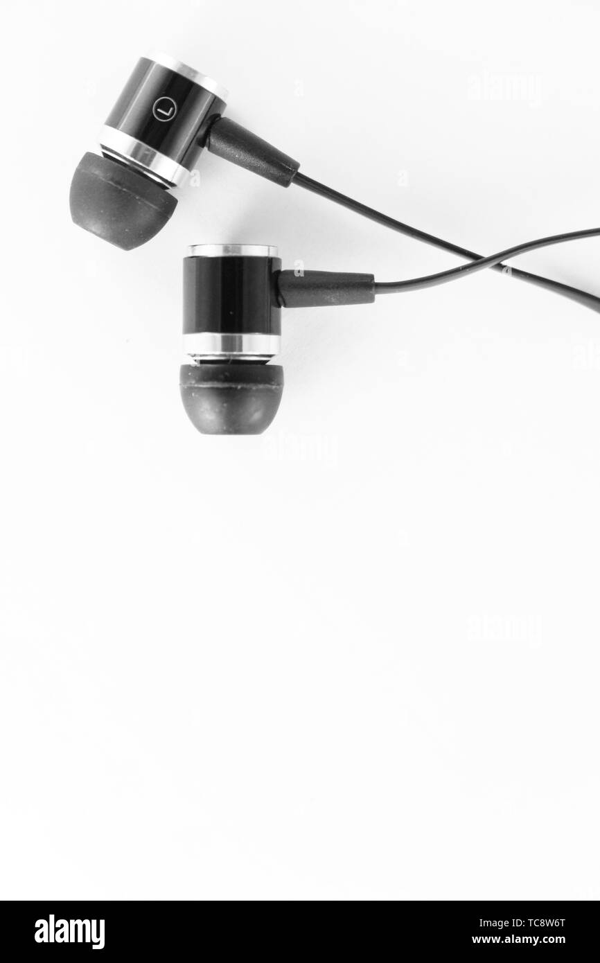 Black wired earbuds Stock Photo