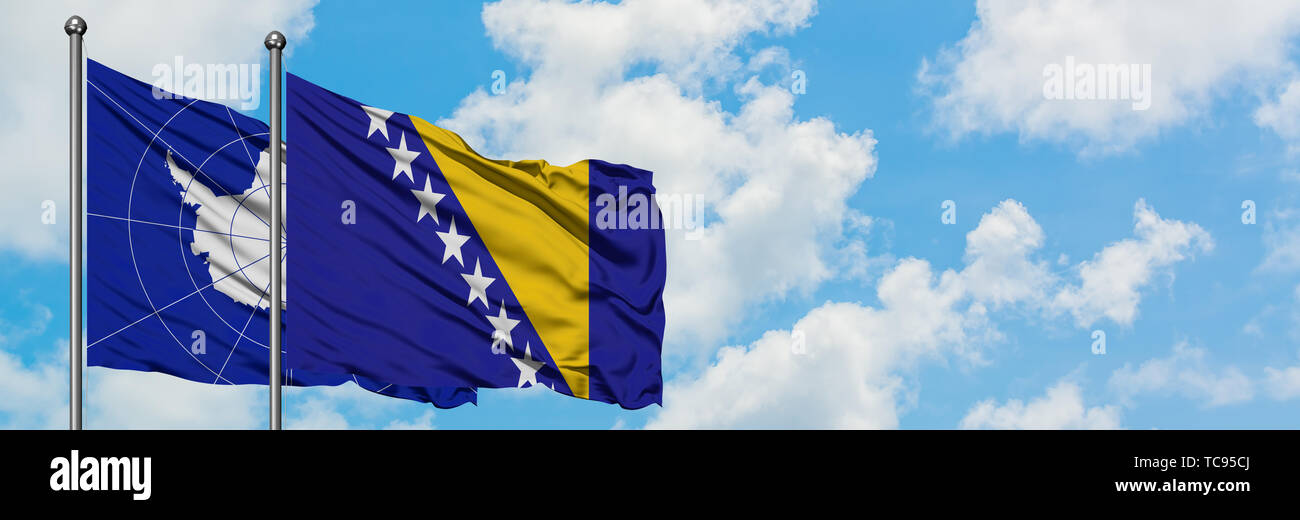 Antarctica and Bosnia Herzegovina flag waving in the wind against white ...