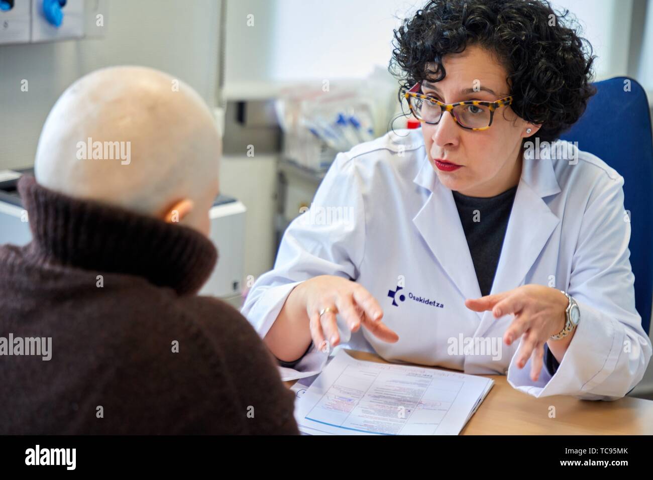 Doctor with cancer patient in medical consultation, Oncology, Hospital Donostia, San Sebastian, Gipuzkoa, Basque Country, Spain Stock Photo