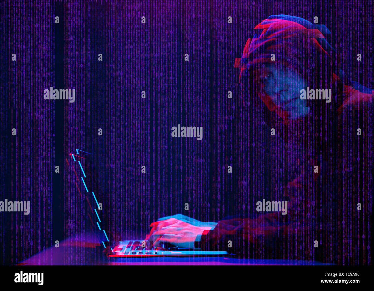 Hacker working with laptop in dark room with digital interface around. Image with glitch effect. Stock Photo