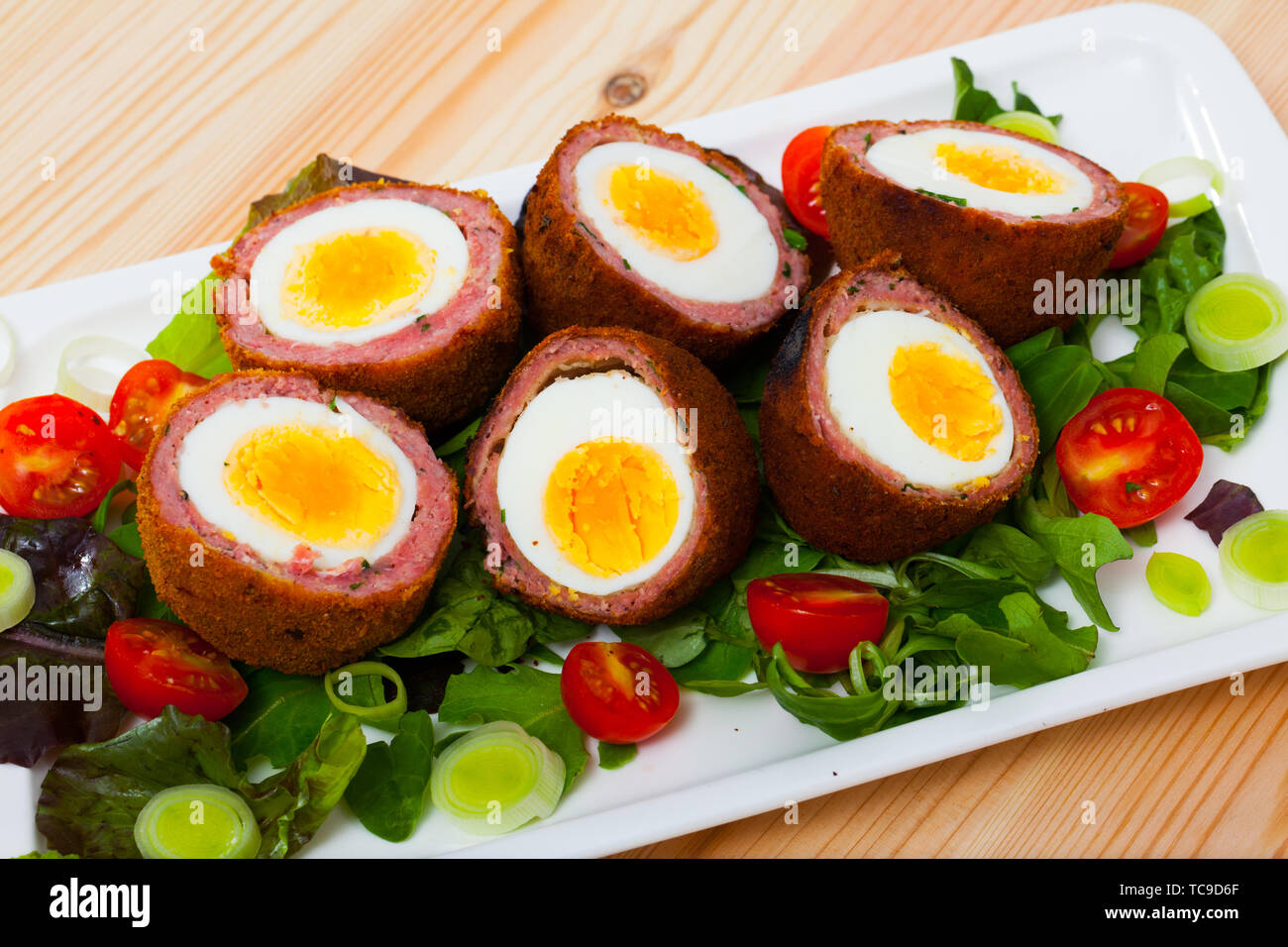 Traditional British picnic food delicious Scotch eggs cut in halves