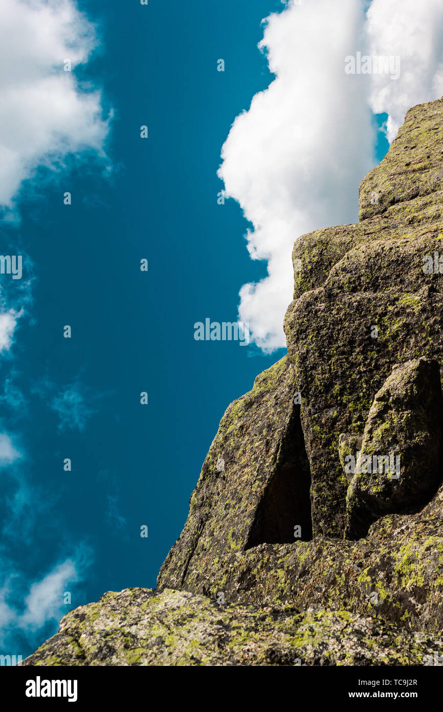 Rocks under blue sky with clouds. View of mountain valley. Tourism ...