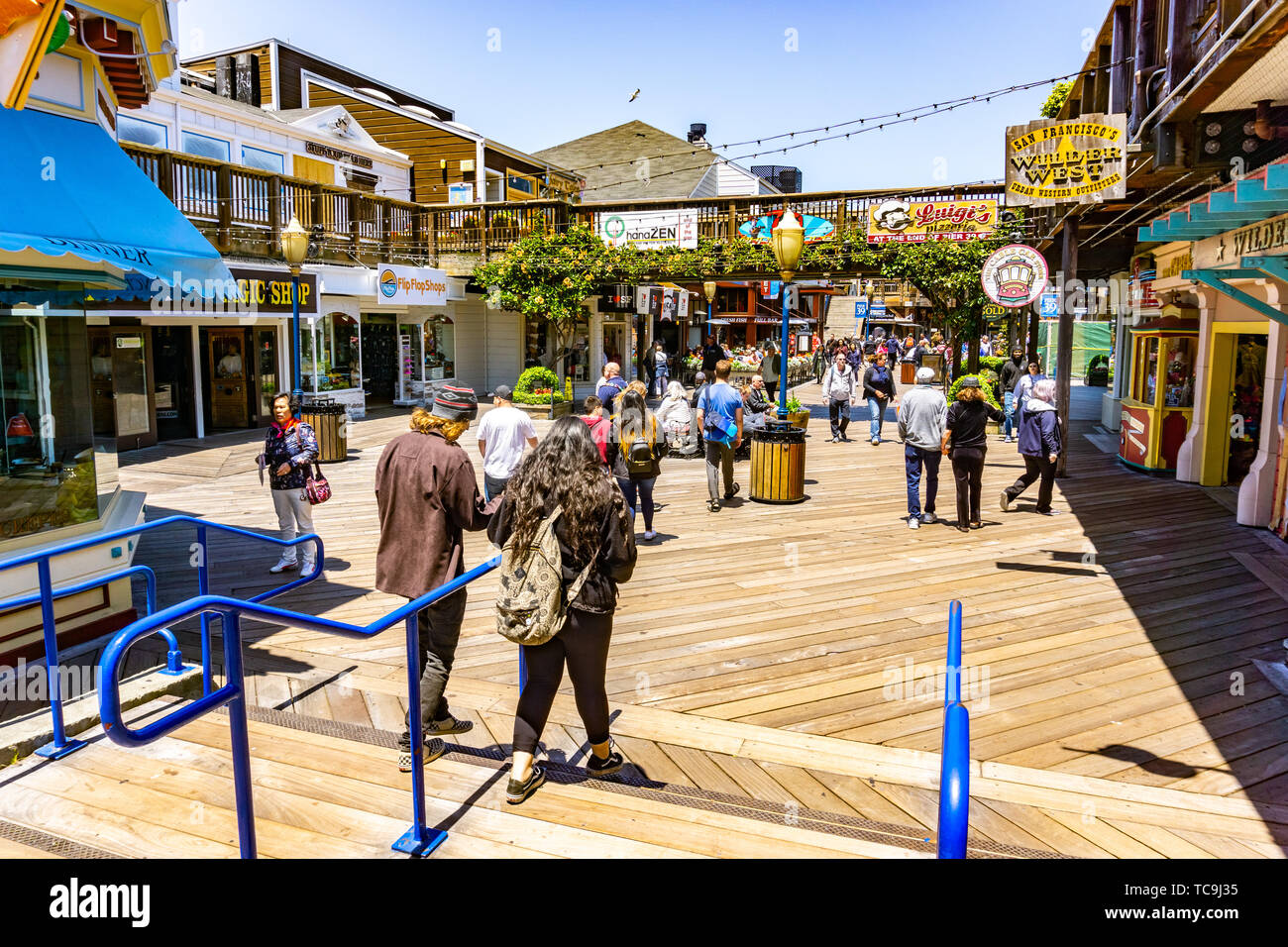 June 3, 2019 San Francisco / CA / USA -  Visitors walk on Pier 39, a shopping center and popular tourist attraction built on a pier in Fisherman's Wha Stock Photo