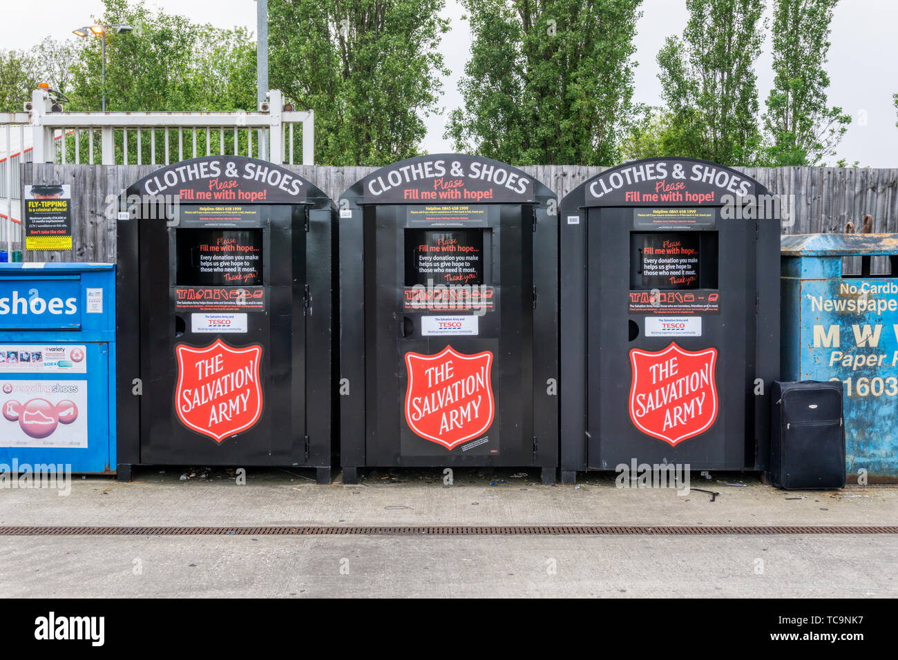 Salvation Army Clothing & Shoe collection points in a Tesco's car park. Stock Photo