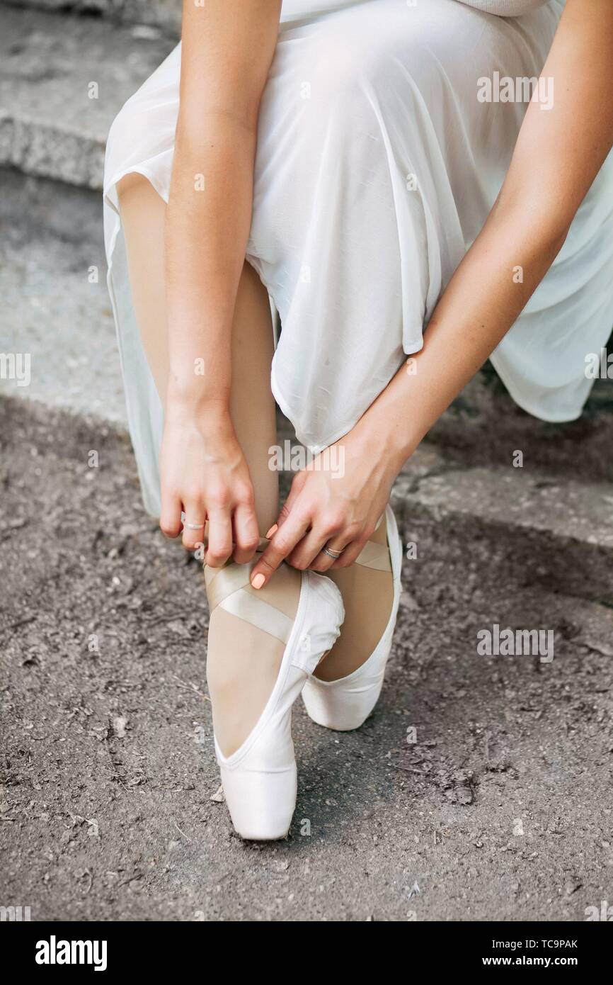 Legs of a beautiful ballerina close-up. Pointe shoes on concrete stairs  Stock Photo - Alamy