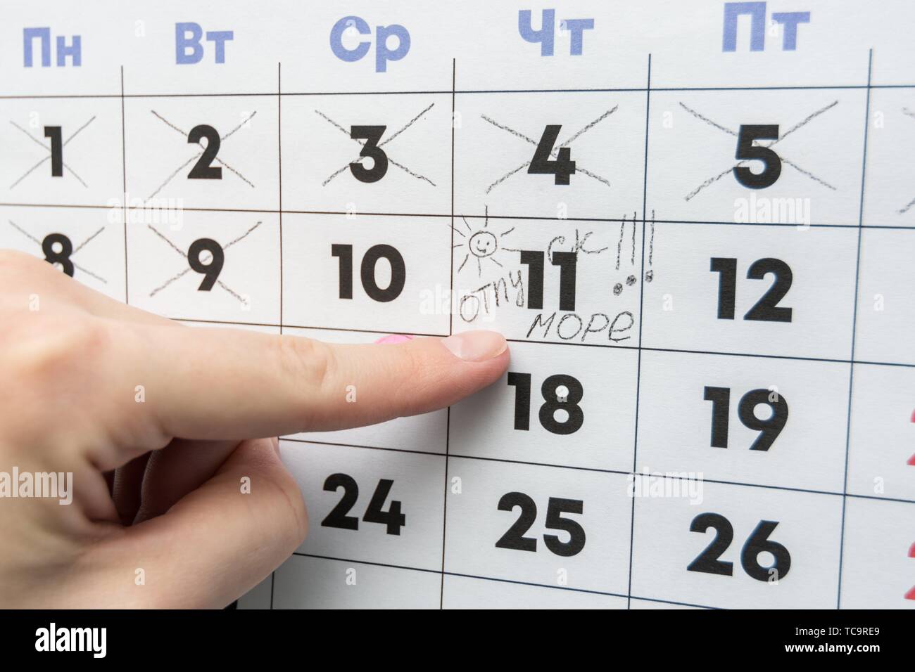 Hand Indicates The Day On The Calendar With The Inscription Vacation Stock Photo Alamy Vacation A Day Calendar