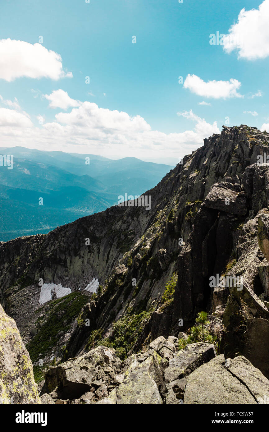 Rocks under blue sky with clouds. View of mountain valley. Tourism ...