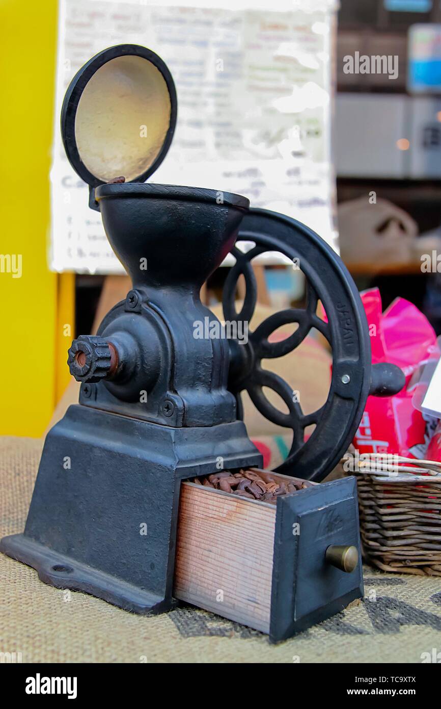 Old coffee grinder displayed at a cafe Stock Photo Alamy