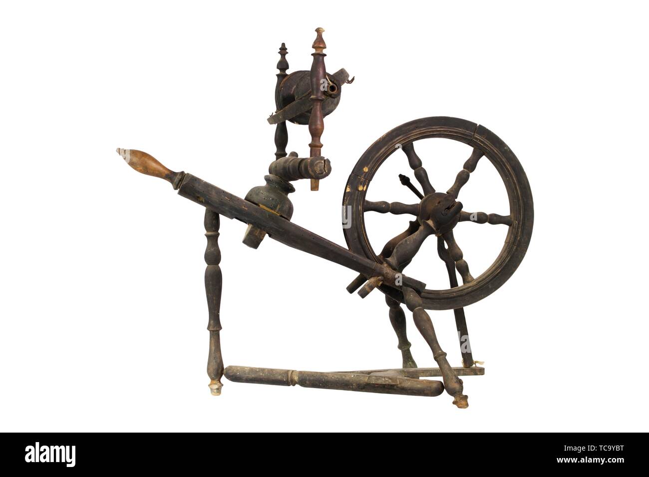 Spinning Wheel For Making Yarn From Wool Fibers. Vintage Rustic Equipment. Stock Photo