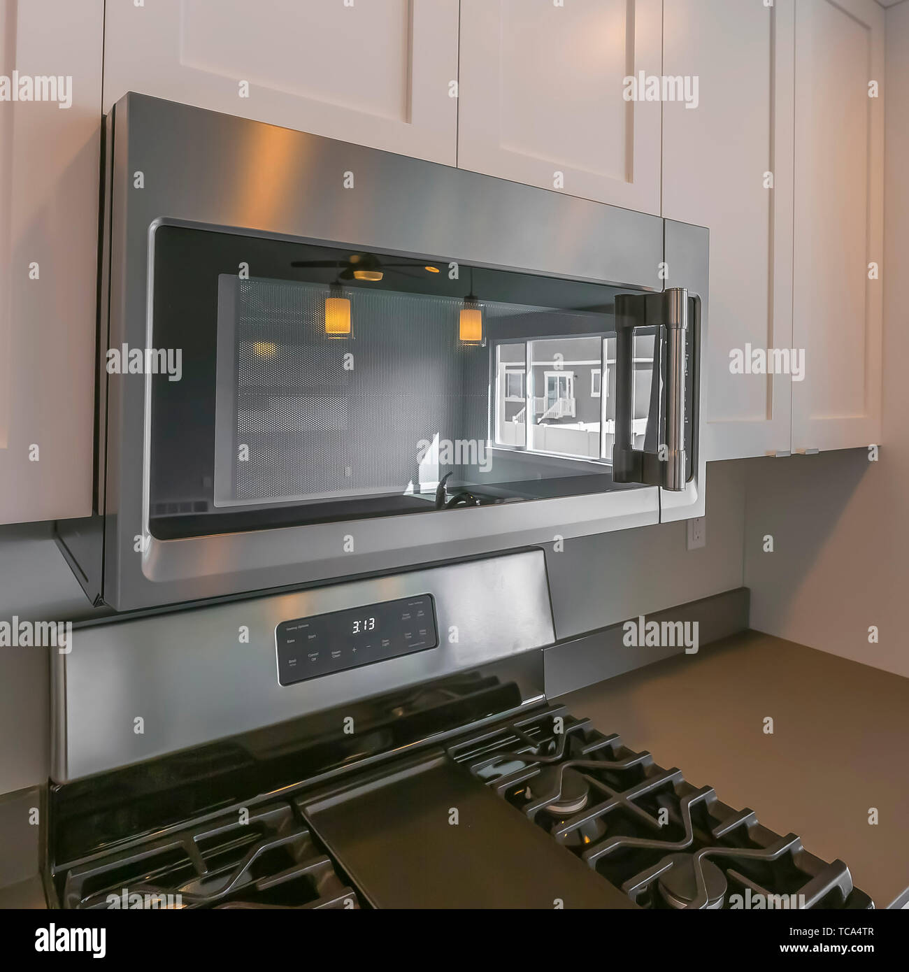 Square Close Up Of The Microwave And Wooden Cabinets Mounted On