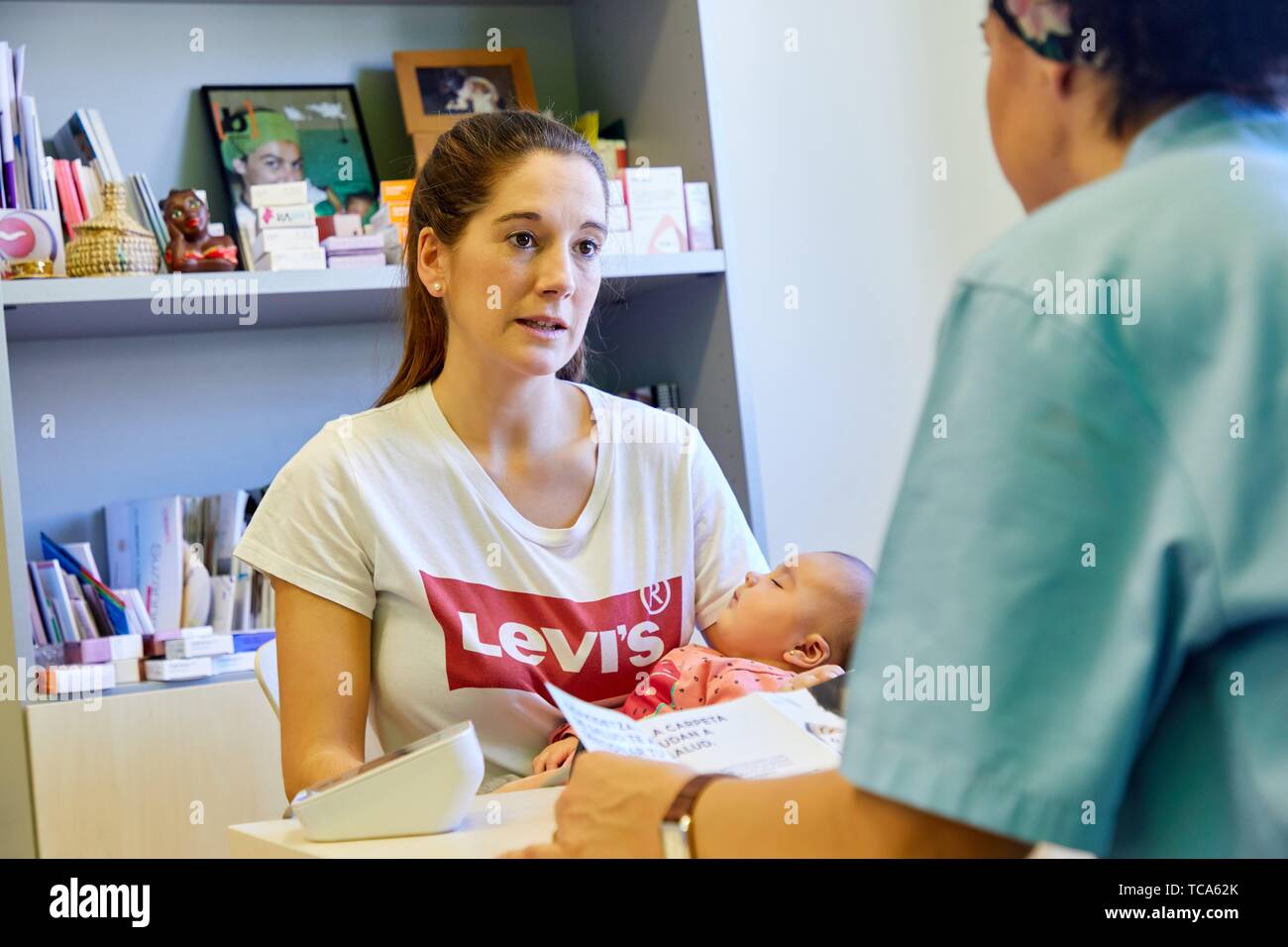 Consultation of Matron with mother and baby, Health Center, Zarautz, Gipuzkoa, Basque Country, Spain Stock Photo