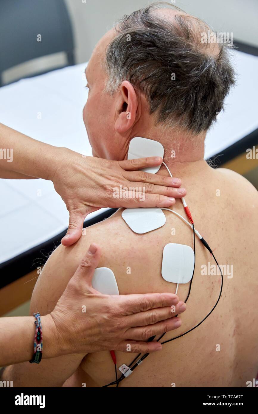 physiotherapist with patient, electro stimulation, Rehabilitation, Amara Berri Health Center building, Donostia, San Sebastian, Gipuzkoa, Basque Stock Photo
