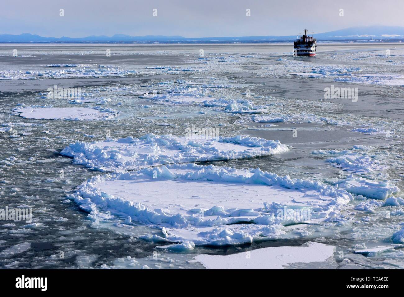 Frozen sea and sightseeing icebreaker, Aurora ship, Abashiri, Hokkaido, Japan, Asia. Stock Photo