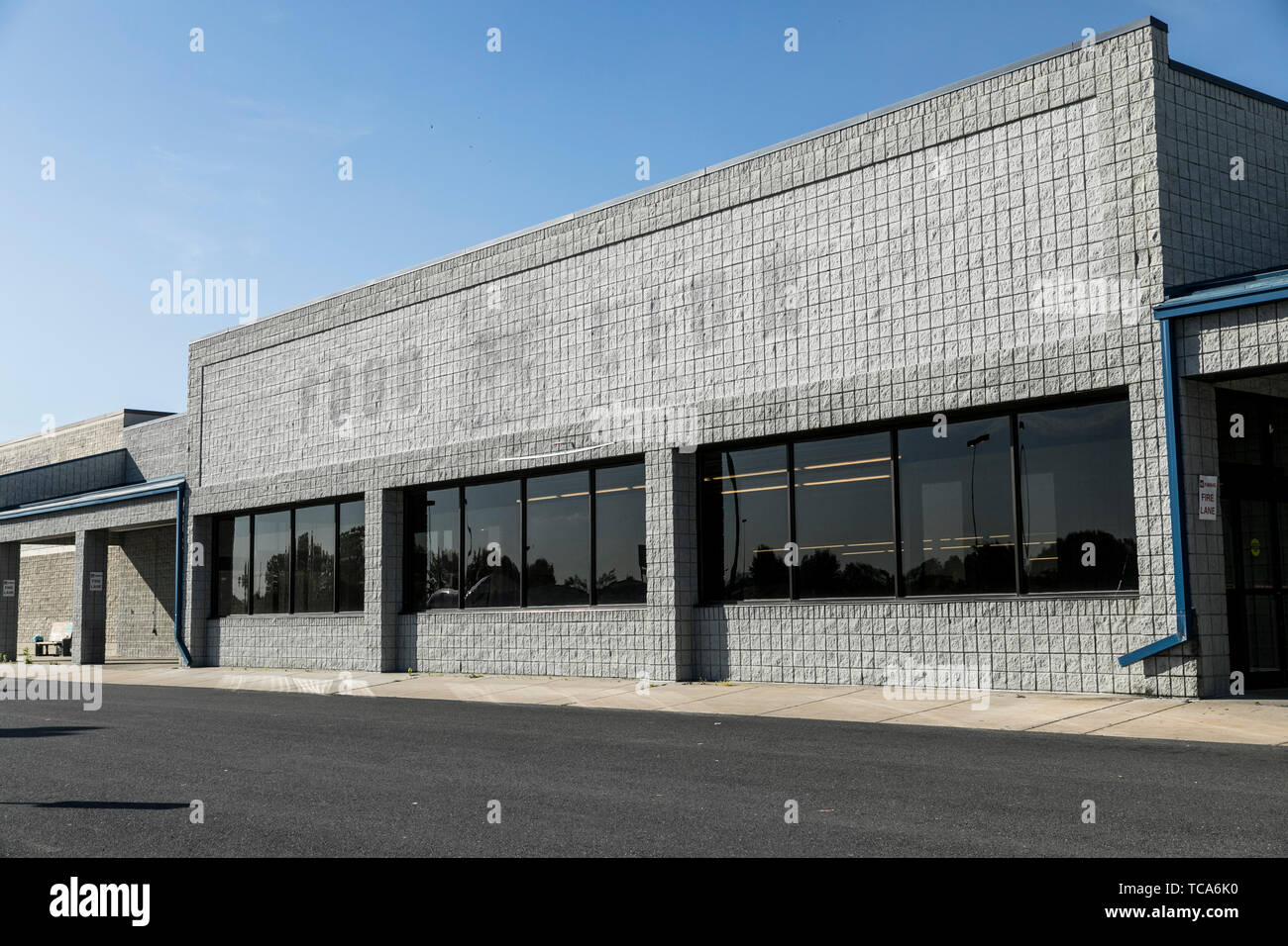 The outline of a logo sign outside of an abandoned Food Lion retail grocery store location in Martinsburg, West Virginia on June 4, 2019. Stock Photo