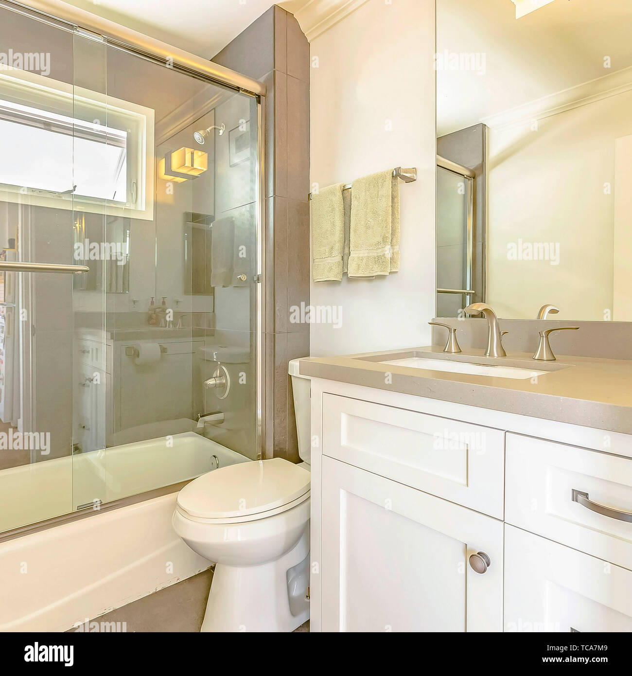 Square Bathtub And Shower With Glass Door And Window Inside The