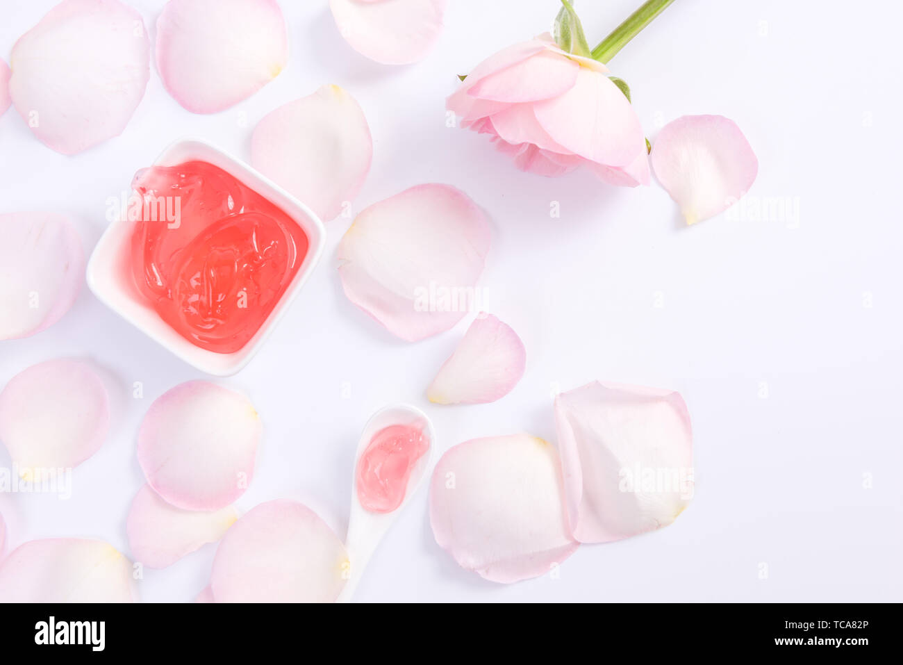 Pink rose petals and skin care lotions Stock Photo Alamy
