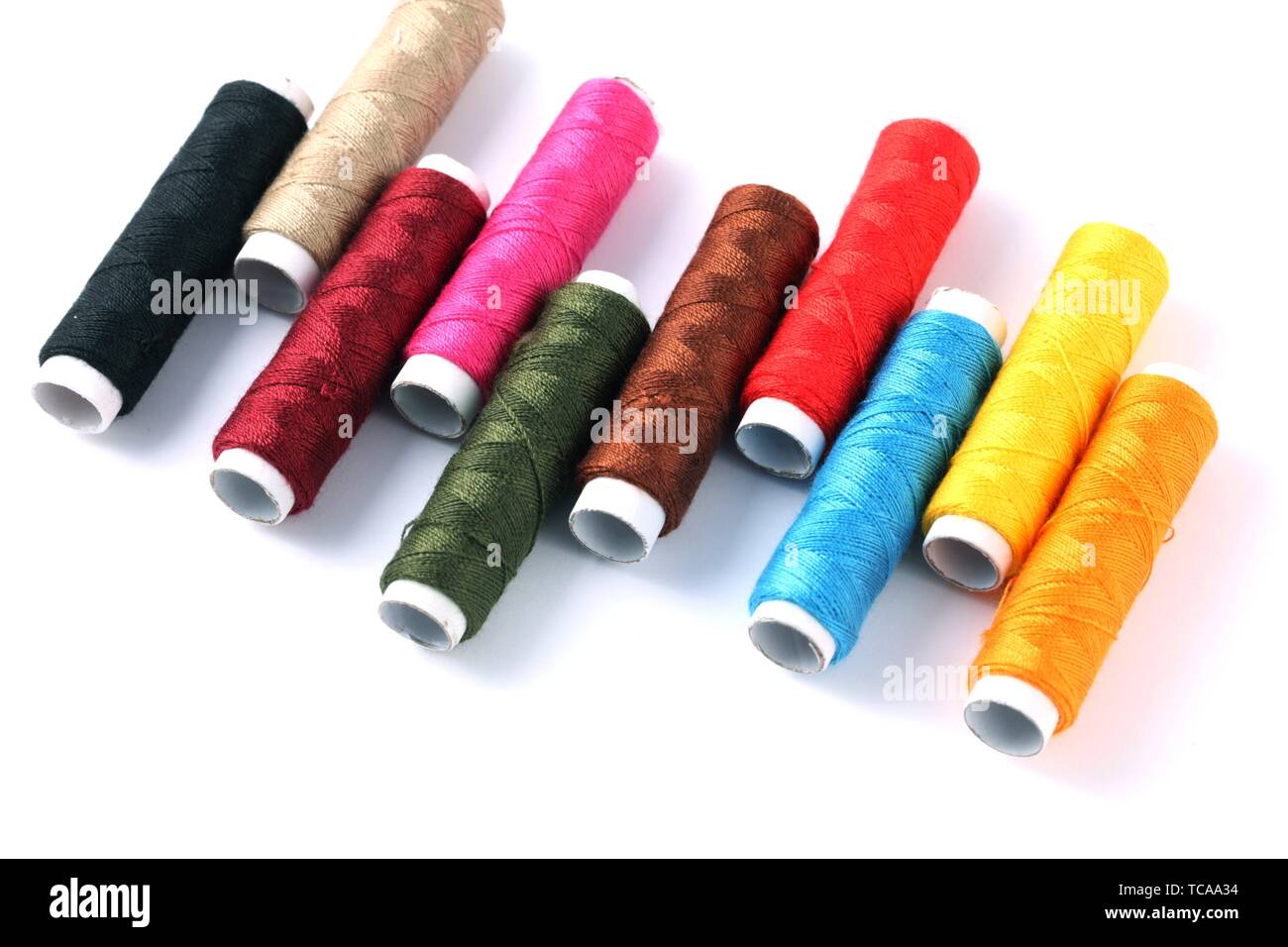 Assorted Colours Thread Reels on white background Stock Photo Alamy