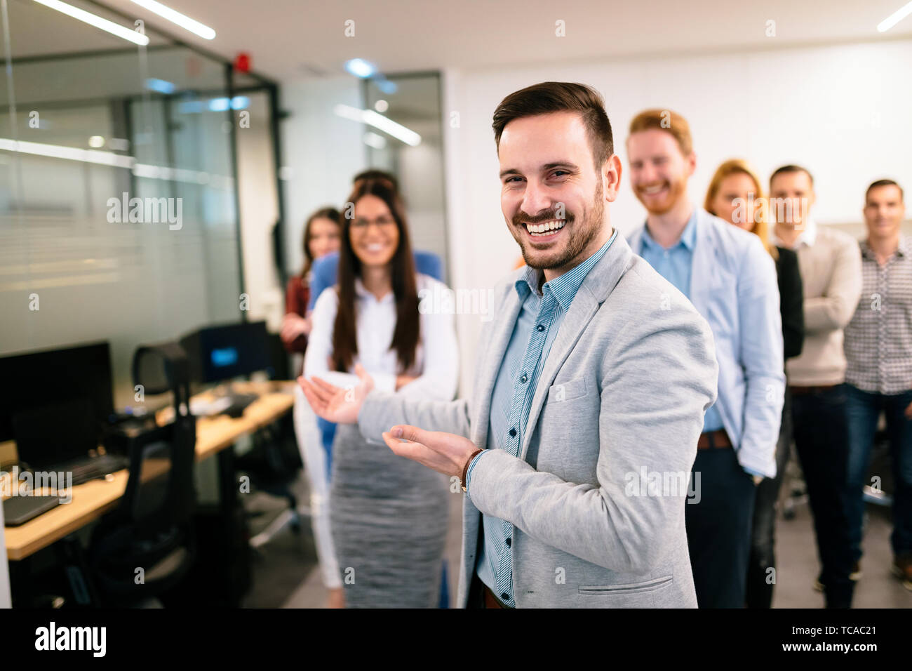 Happy business team posing in hi-res stock photography and images - Alamy