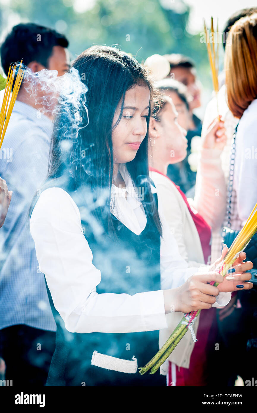 Burning incense sticks in cambodian temple hi-res stock photography and ...