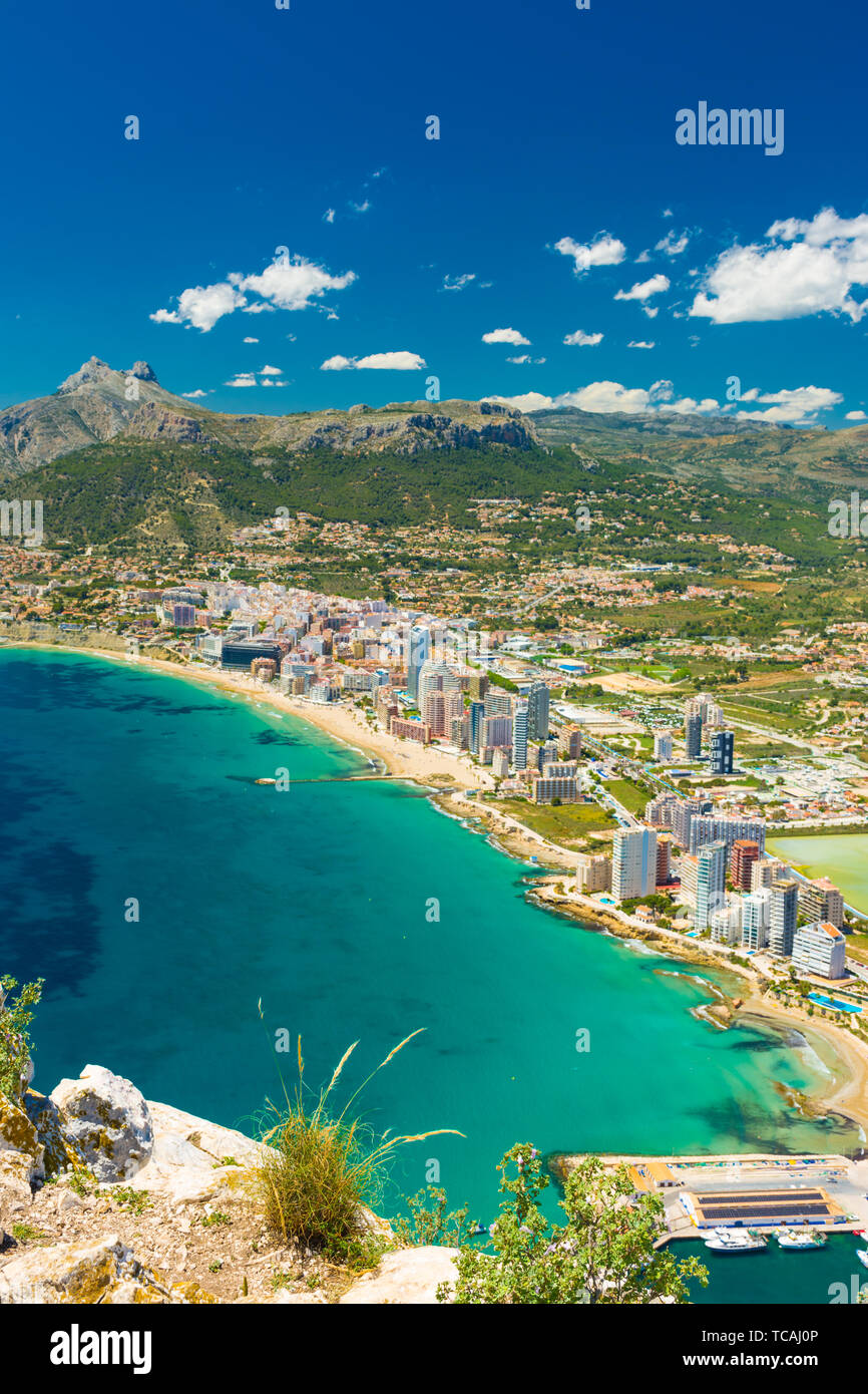 View of the area of apartments and hotels in Calpe, Alicante, Spain,  with the marina and the salt pans from the top of the rock of Ifach Stock Photo