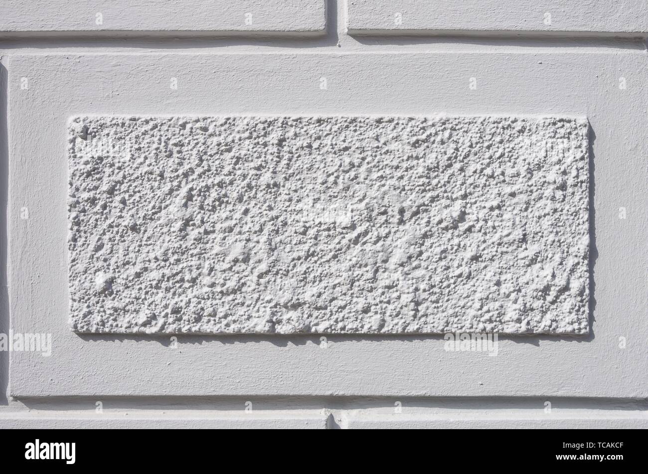 Detail einer Aussenfassade mit Rechtecken aus grob strukturiertem Putz, Hansestadt Wismar, Deutschland. Detail of an exterior facade with rectangular Stock Photo