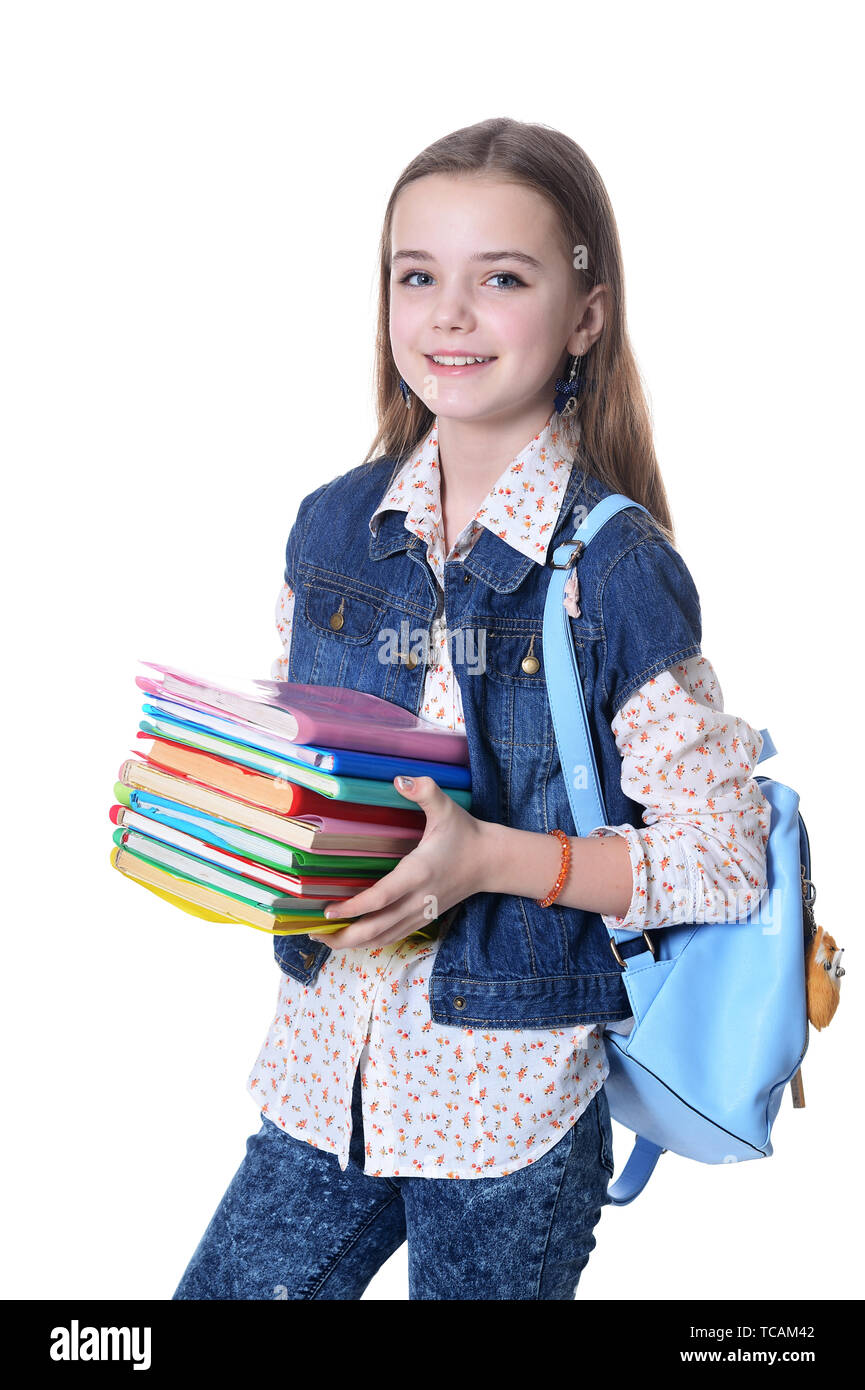 Happy schoolgirl posing with books on white background Stock Photo - Alamy