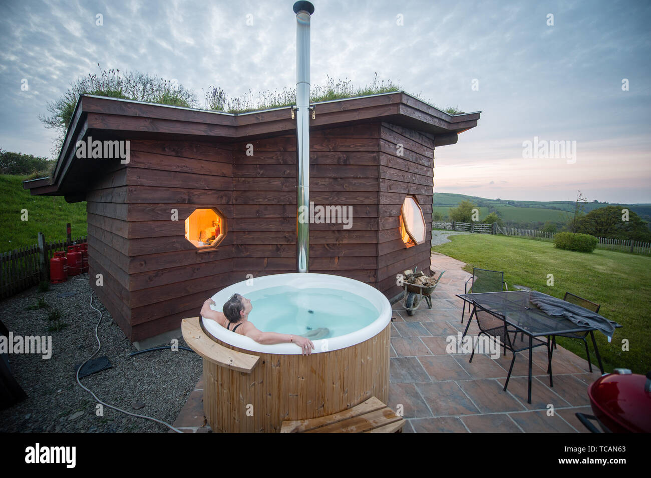 Sustainable Tourism In The Uk Treberfedd Farm Eco Lodge Log Cabins With Log Burning Wood Fuelled Outdoor Hot Tub Aeron Valley Ceredigion Wales Uk Stock Photo Alamy
