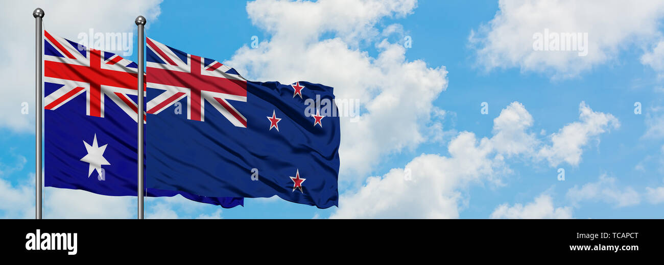 and New Zealand flag waving in the wind against white cloudy blue sky together. Diplomacy concept, international relations Stock Photo - Alamy