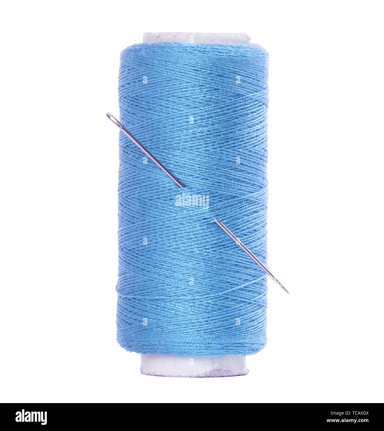 Blue thread and needle isolated on white, Stock image