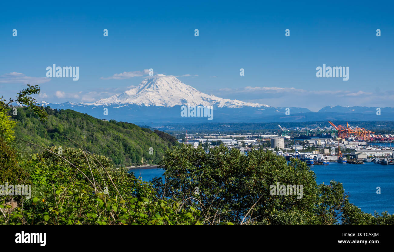 Snow-covered Mount Rainier towers over the Port Of Tacoma Stock Photo ...