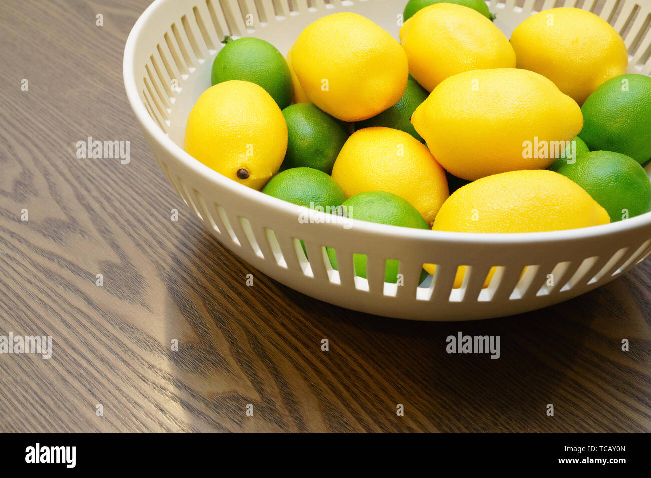 bowl of lemons and limes Stock Photo Alamy